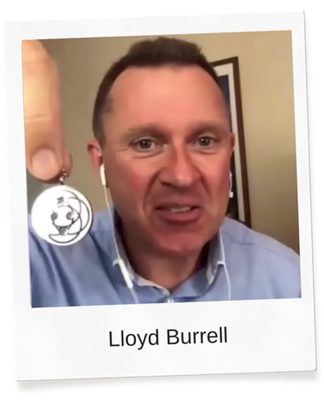 Lloyd Burrell holding a Harmoni Pendant